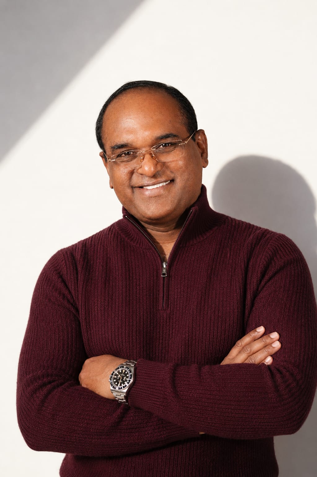 Portrait of Binesh Ravindran in a navy suit